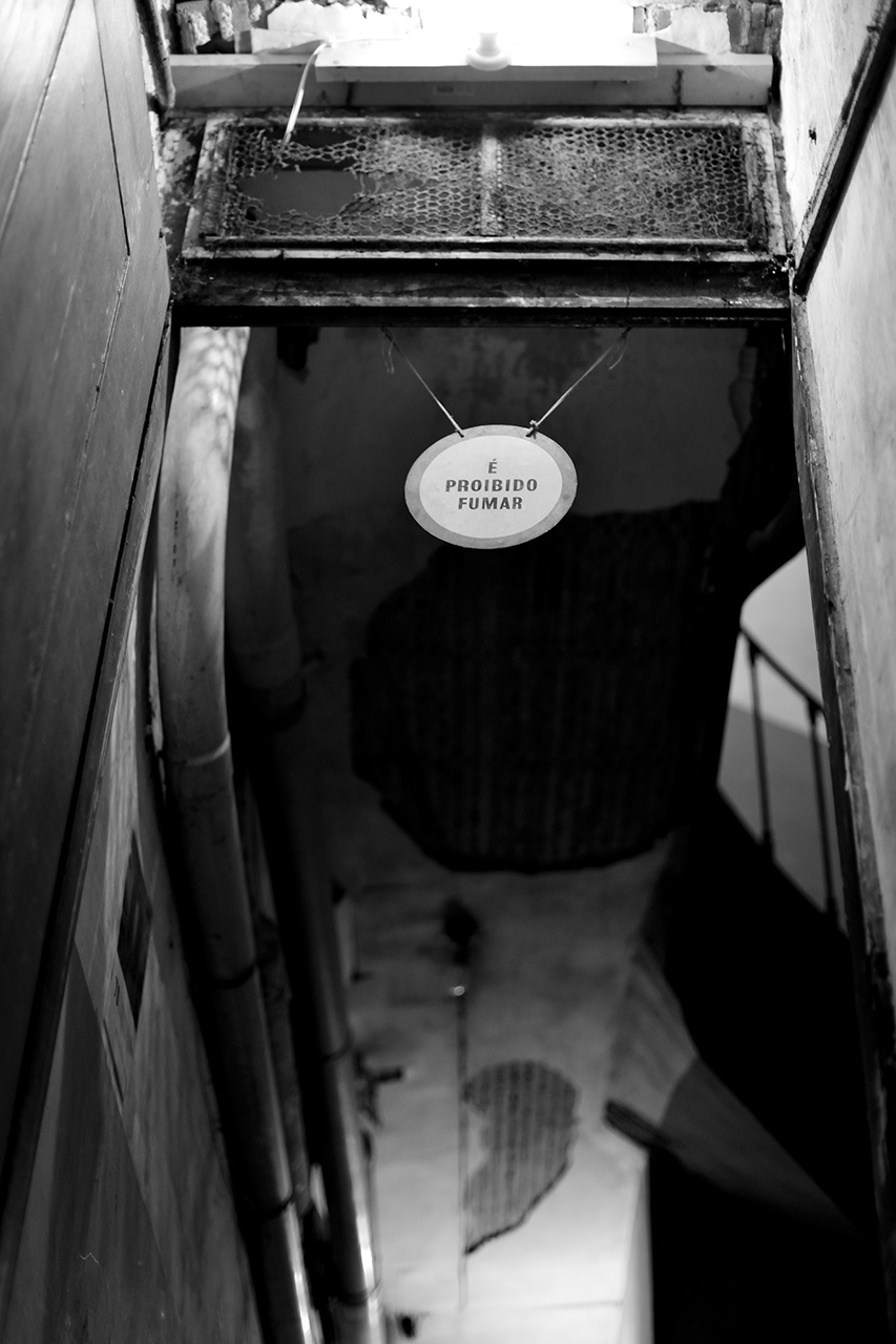 hanging sign on the way to the basement