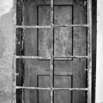 door behind bars