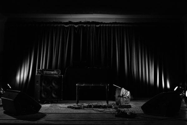 the cello, the amplifier and the bench